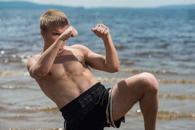 Muscular male fighter training 