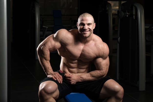 Muscular Man After Exercise Resting In Gym