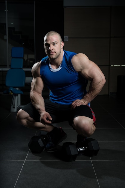 Muscular Man After Exercise Resting In Gym