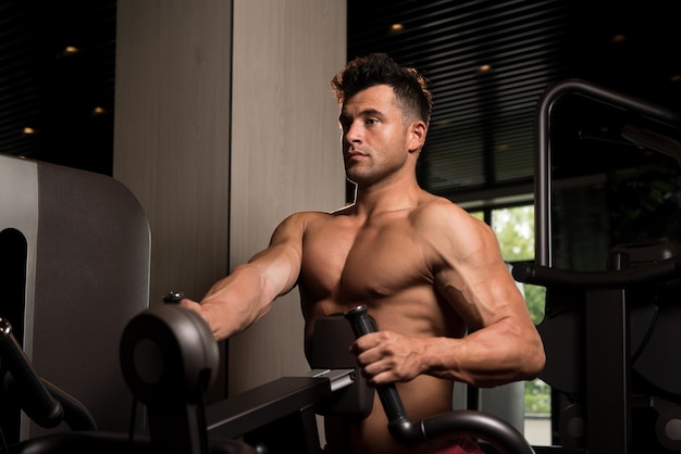 Muscular Man Doing Heavy Weight Exercise For Back