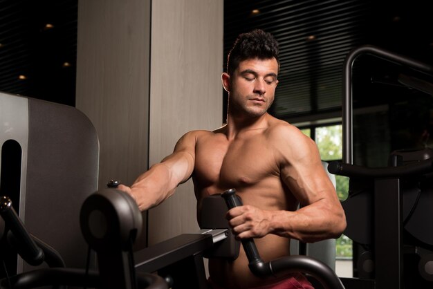 Muscular Man Doing Heavy Weight Exercise For Back