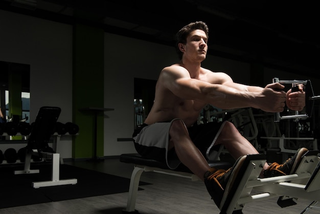 Muscular Man Doing Heavy Weight Exercise For Back