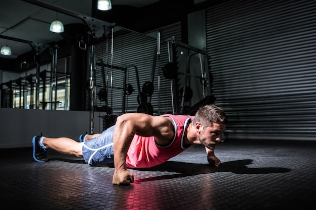 Muscular man doing push-ups