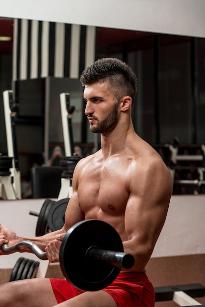 Muscular Man Exercising Biceps