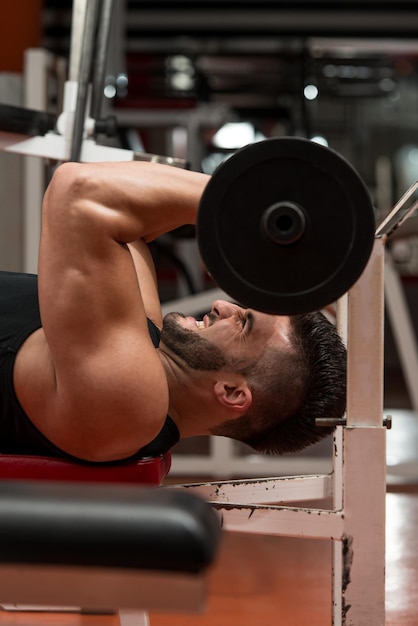 Muscular Man Exercising Triceps