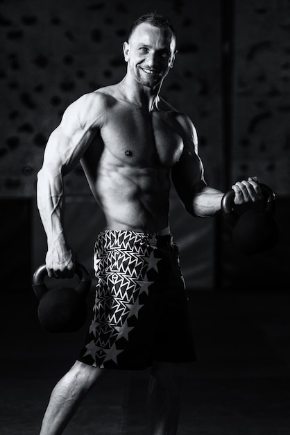 Muscular Man Exercising With Kettlebell