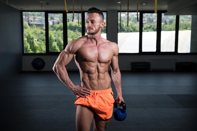 Muscular Man Exercising With Kettlebell