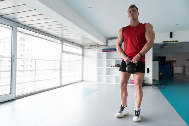 Muscular Man Exercising With Kettlebell