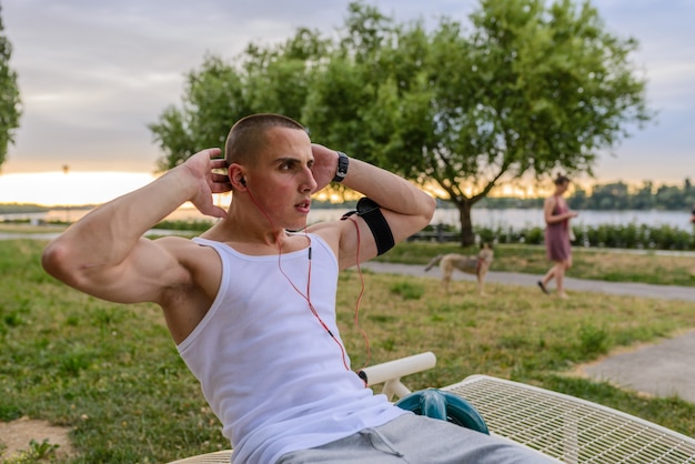 Muscular man during his workout outdoors