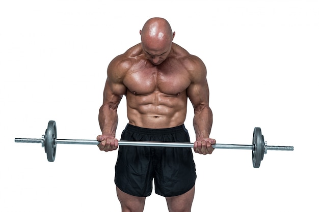 Muscular man lifting crossfi