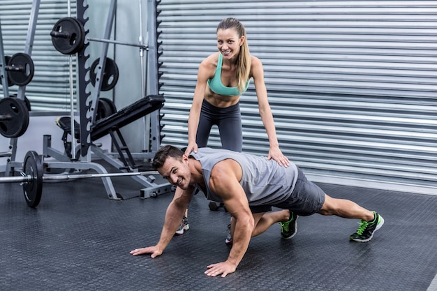 Muscular man on a plank position