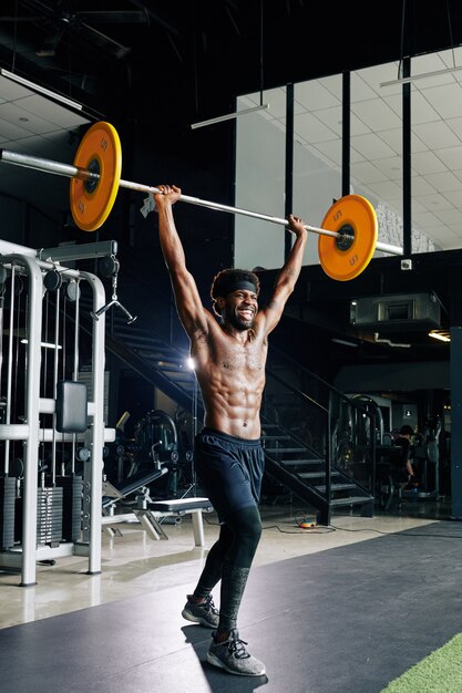 Muscular man practicing lifting