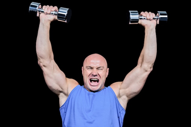 Photo muscular man with arms raised lifting dumbbells