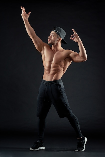 Muscular man with athletic body posing