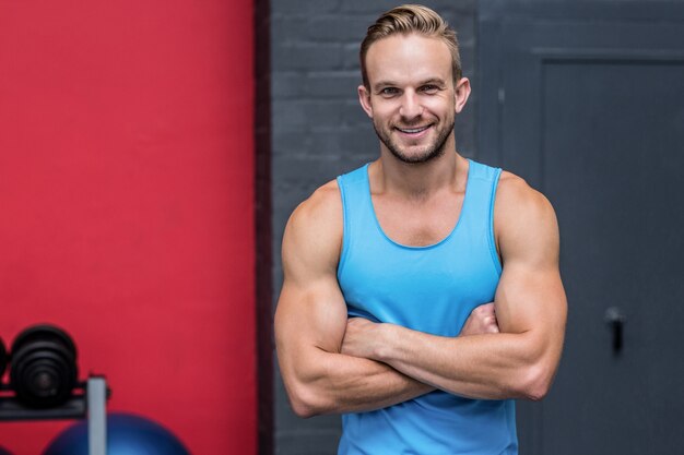 Muscular man with crossed arms 