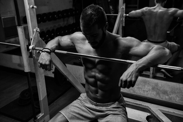 Muscular Model Resting On Bench After Exercise