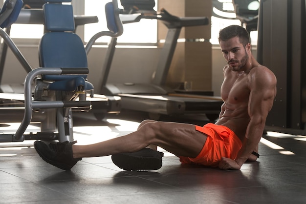 Muscular Model Resting On Bench After Exercise