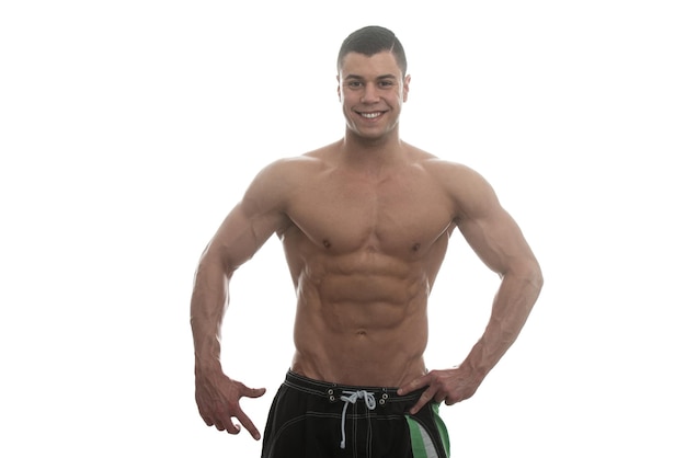 Muscular Young Man Posing In Studio  Isolated On White Background