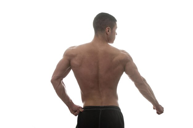 Muscular Young Man Posing In Studio  Isolated On White Background