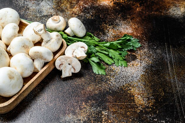 Mushroom champignon  in a bamboo bowl.