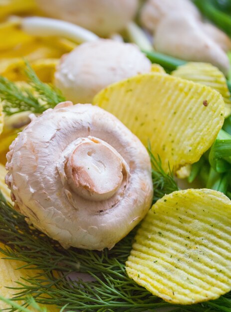 Mushroom champignon close-up with chips