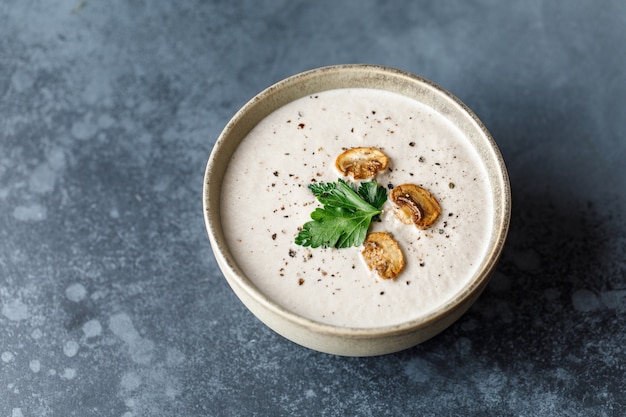 Mushroom cream soup on dark surface