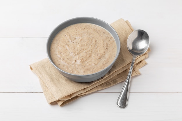 Mushroom cream soup on a wooden surface