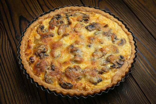 Mushroom pie on a brown wooden table