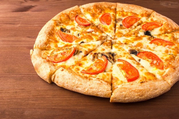 Mushroom pizza with cheese and tomatoes