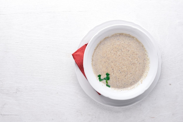 Mushroom puree soup On a wooden background Top view Free space for text