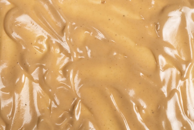 Mushroom sauce as a background. Top view.