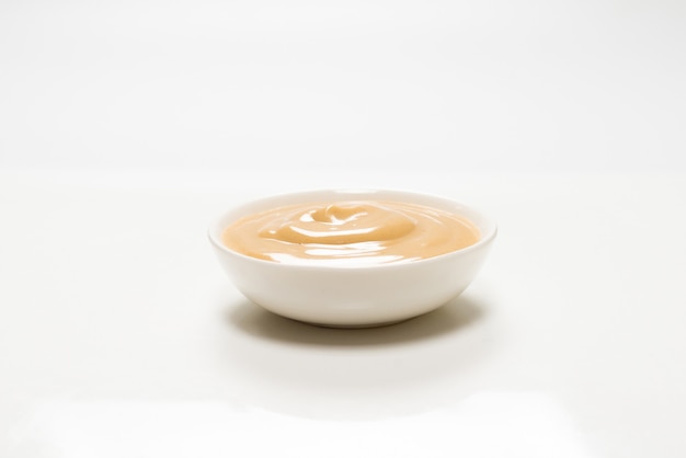 Mushroom sauce in a bowl isolated on white background. Top view.