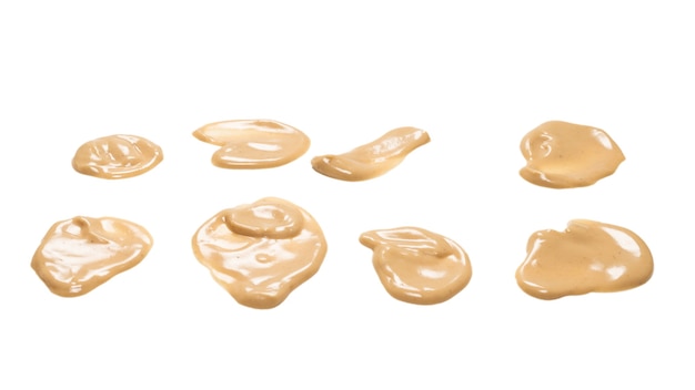 Mushroom sauce splashes isolated on white background. Top view.