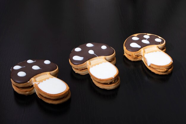 Mushroom shaped cookies on a wooden table