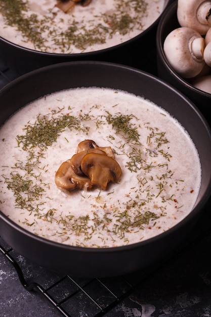 Mushroom soup. Soup with fresh mushrooms. Two plates of cream soup with vegetables