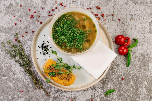 Mushroom soup with herbs and sandwich