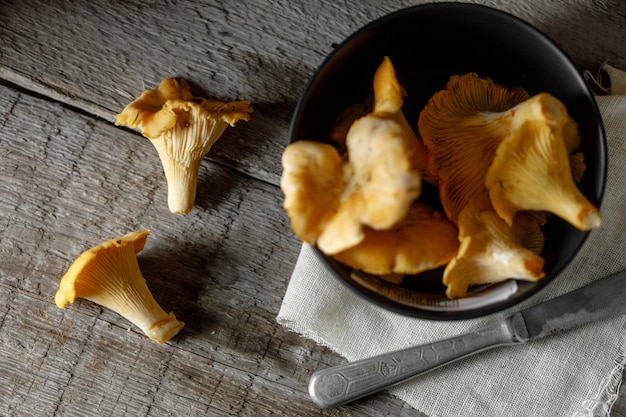 Mushrooms chanterelle on wooden vintage background