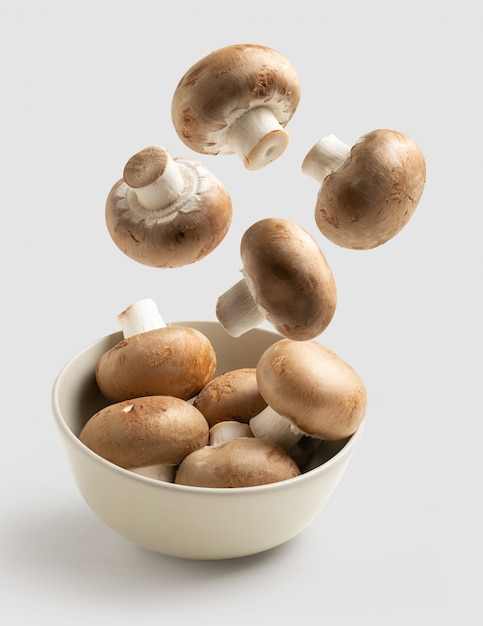 Mushrooms flying white bowl