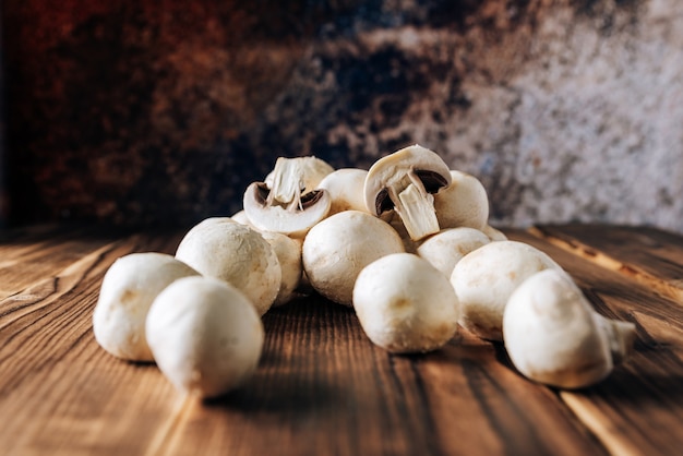 Mushrooms on a wooden background close up 