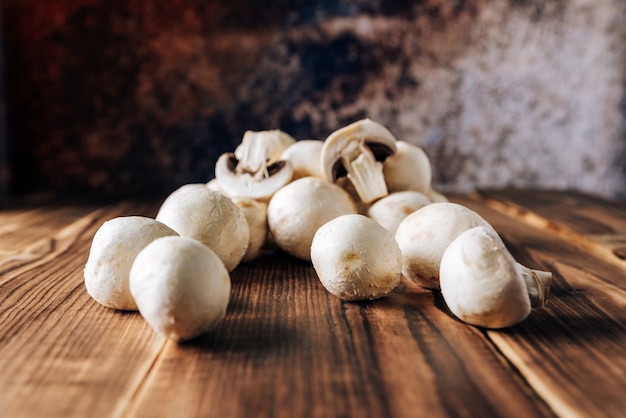 Mushrooms on a wooden background close up 