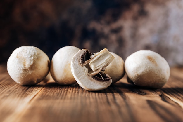 Mushrooms on a wooden background close up 