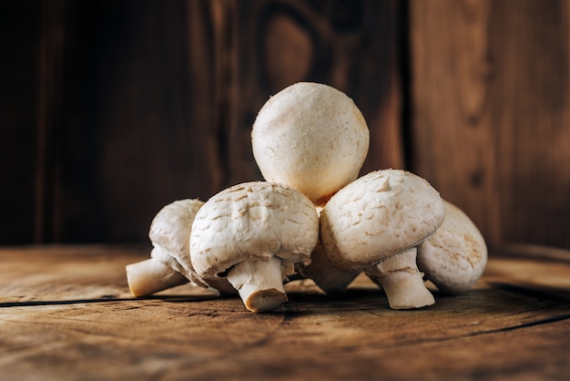 Mushrooms on a wooden background close up