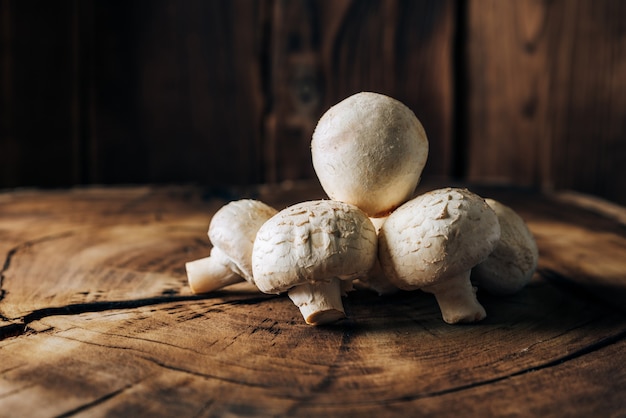 Mushrooms on a wooden background close up 