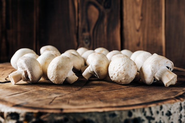 Mushrooms on a wooden background close up 