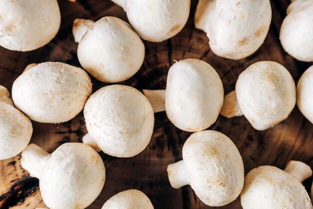 Mushrooms on a wooden background close up 