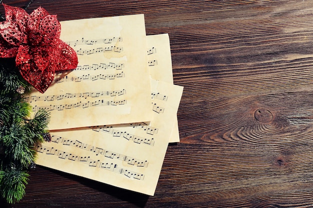 Music and Christmas decor on wooden table