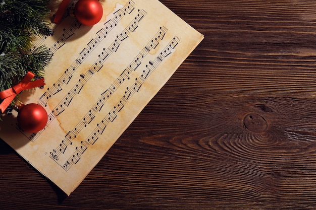 Photo music and christmas decor on wooden table