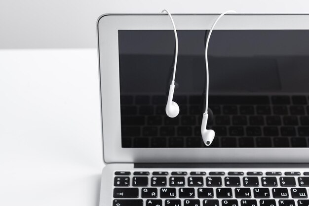 Music concept - Headphones over laptop