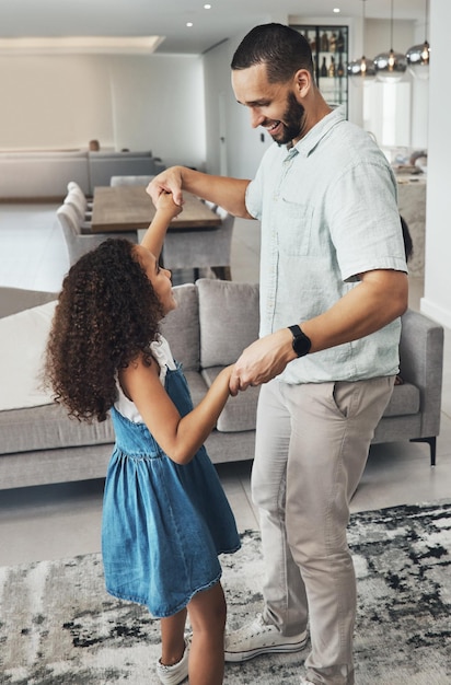 Music love and father dance with girl in living room for playing bonding and having fun in their home Podcast happy family and man with daughter in lounge for dancing happy and smile on weekend