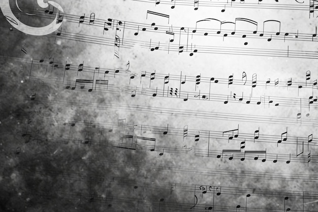 Фото Листы музыкальных нот на сером фоне с копировальным пространством